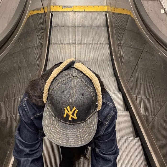 A classic flat fitted cap styled with streetwear.