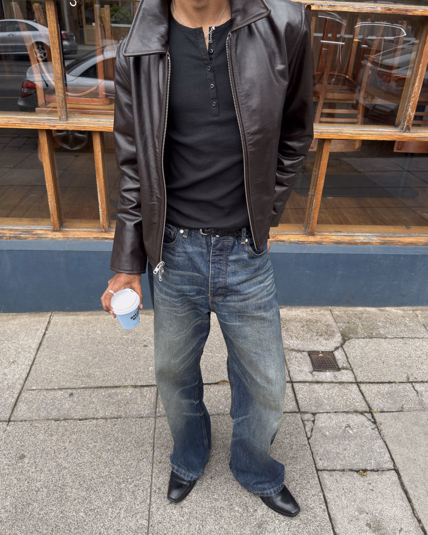 A menswear outfit built around blue bootcut jeans.