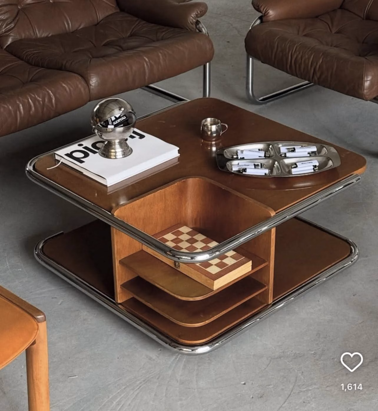 A living room with two sofas and a checked coffee table between them.